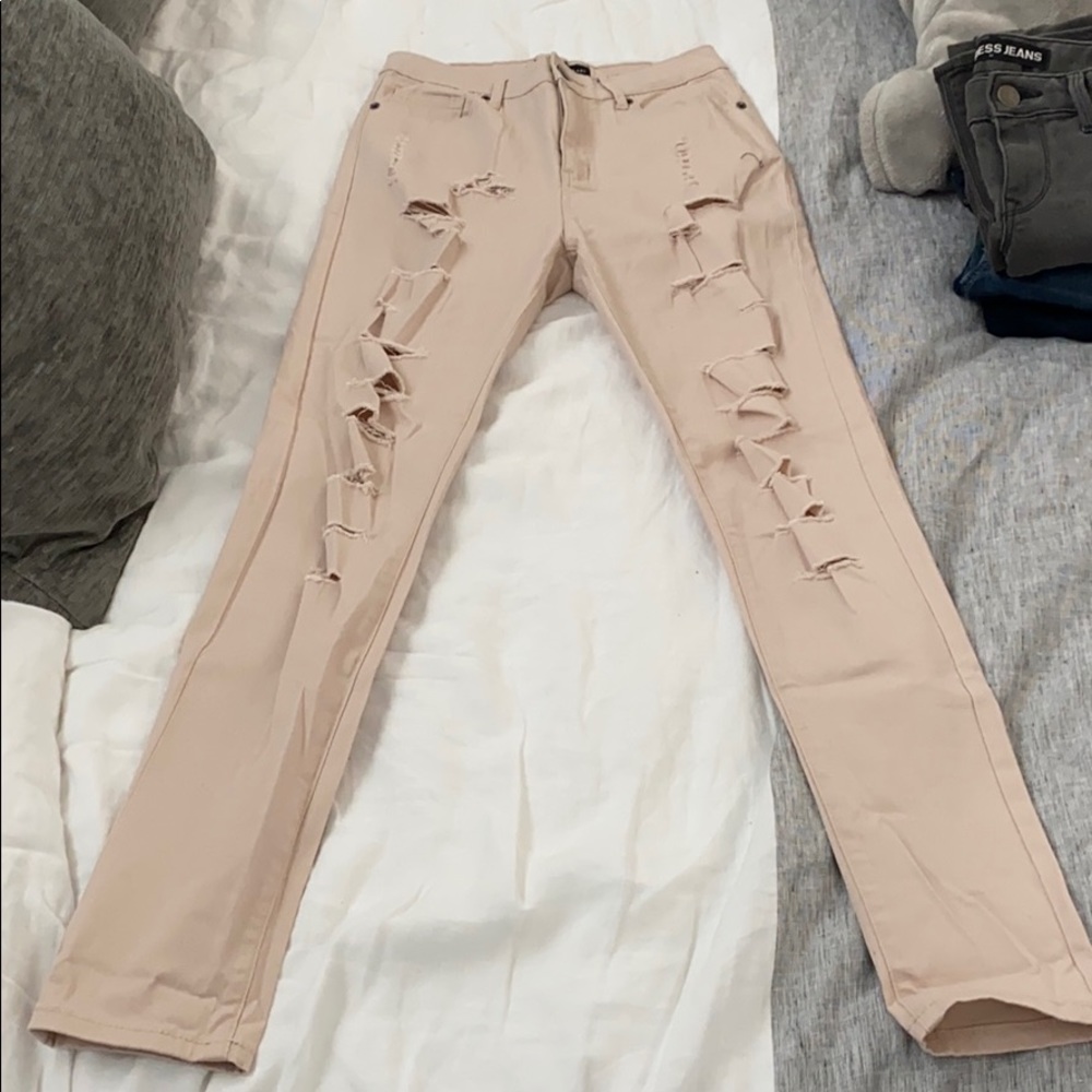 Light pink ripped jeans